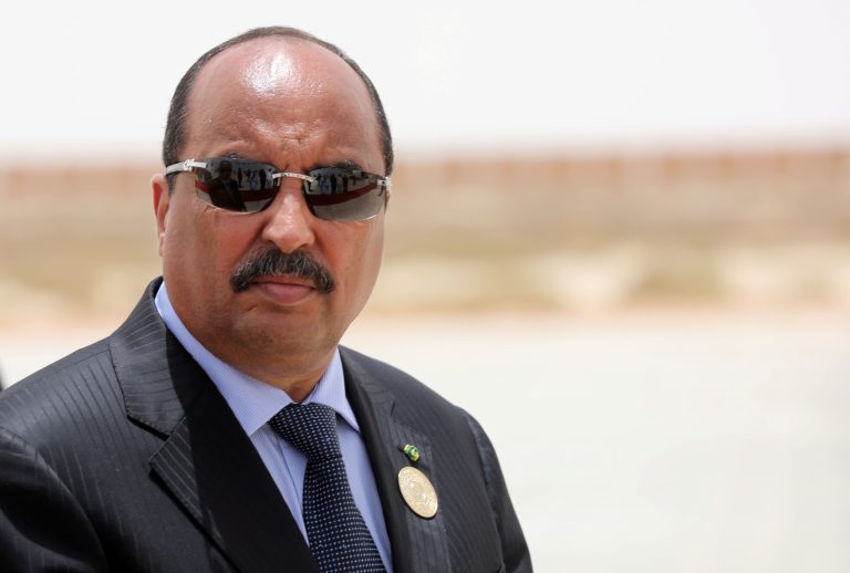 FILE PHOTO: Mauritanian President Mohamed Ould Abdel Aziz waits the arrival of his French counterpart  Emmanuel Macron at Nouakchott airport, Mauritania