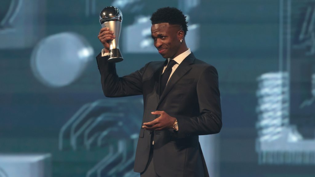 Vinicius Jr holding his FIFA Best Men;s Player Award