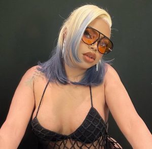 Bobrisky Flaunts Curves in Bold Black Pantyhose Look