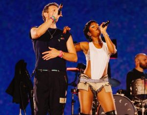 Ayra Starr Slays in Fishnets & Cowboy Vest on Coldplay Stage